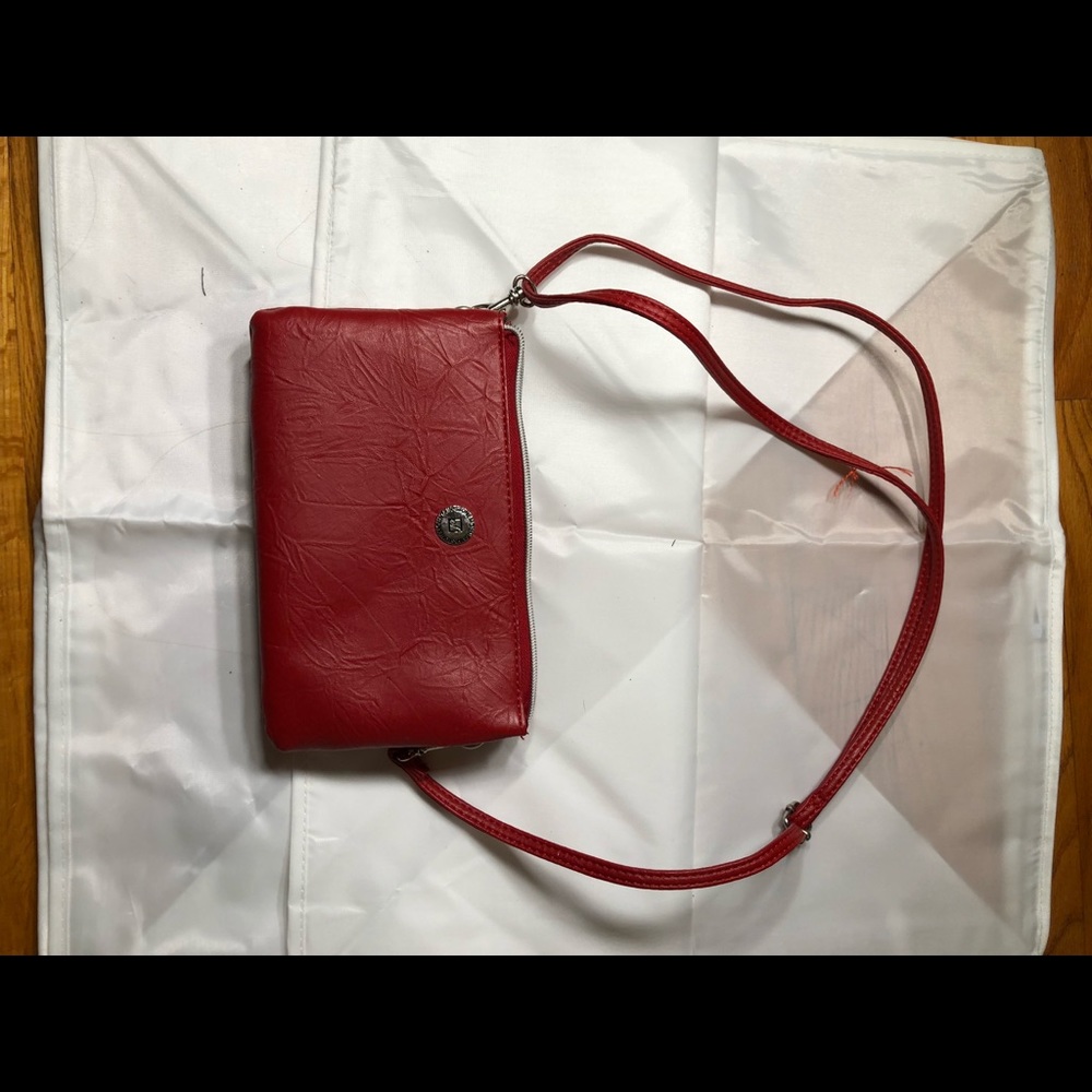 Red, faux leather mini purse. Never used, great condition.